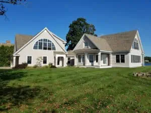 Before phot of this contemporary Cape Neddick, Me. home that was experiencing lost shingles and deteriorating granules from the salt water and sun conditions.
